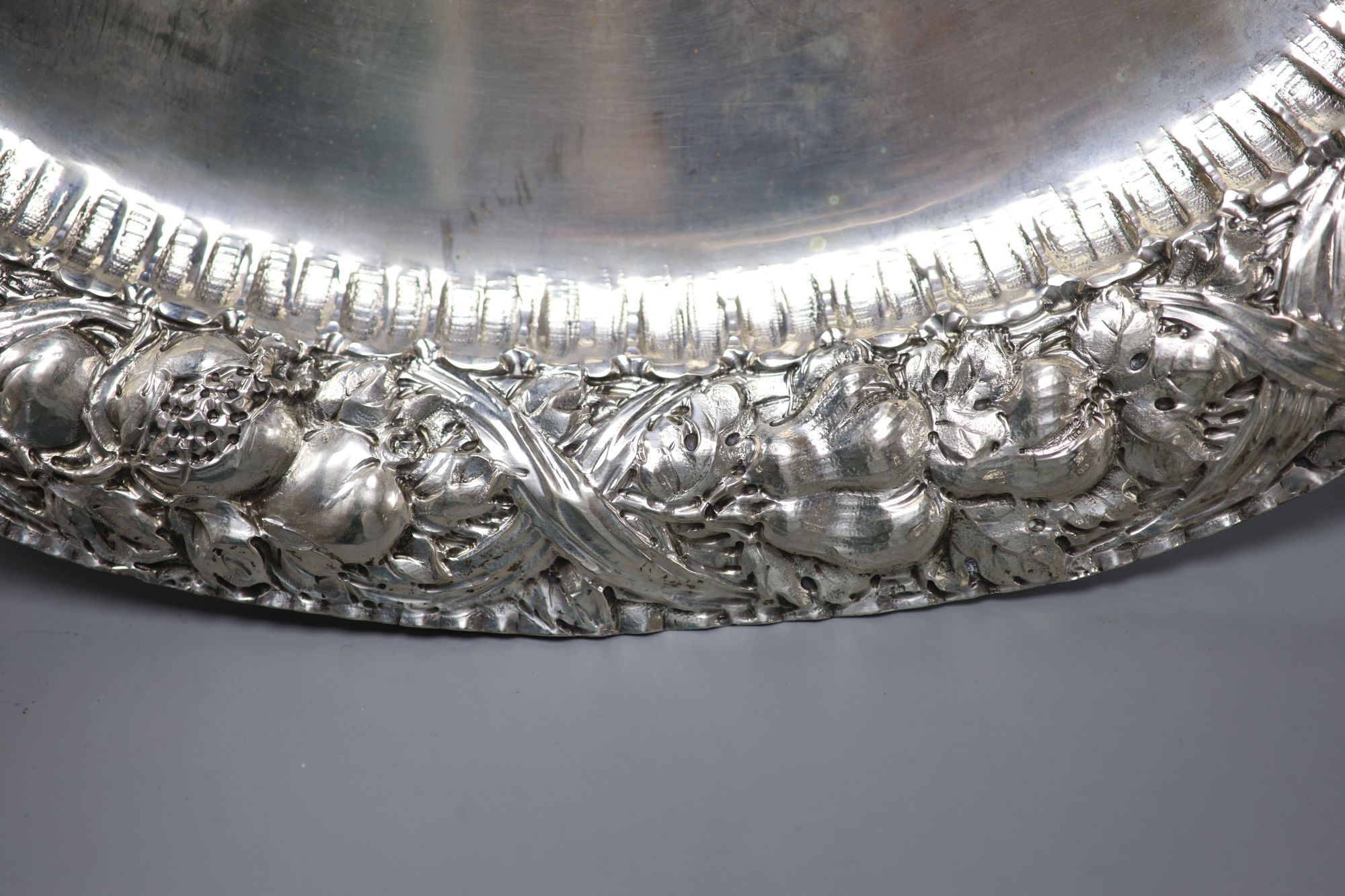 An Italian 800 standard white metal oval tray, the edge embossed with fruits 35oz approx; L 48.5cm